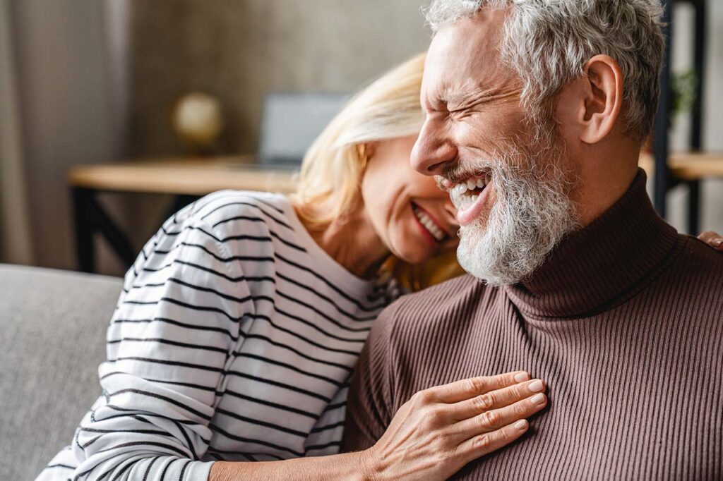 Couple laughing at home